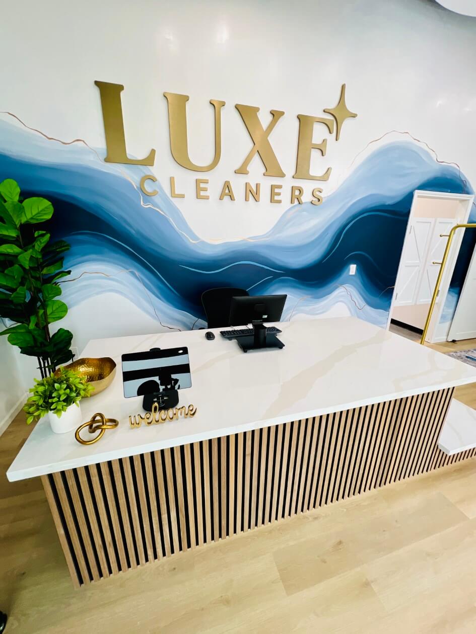 luxe cleaners storefront sign